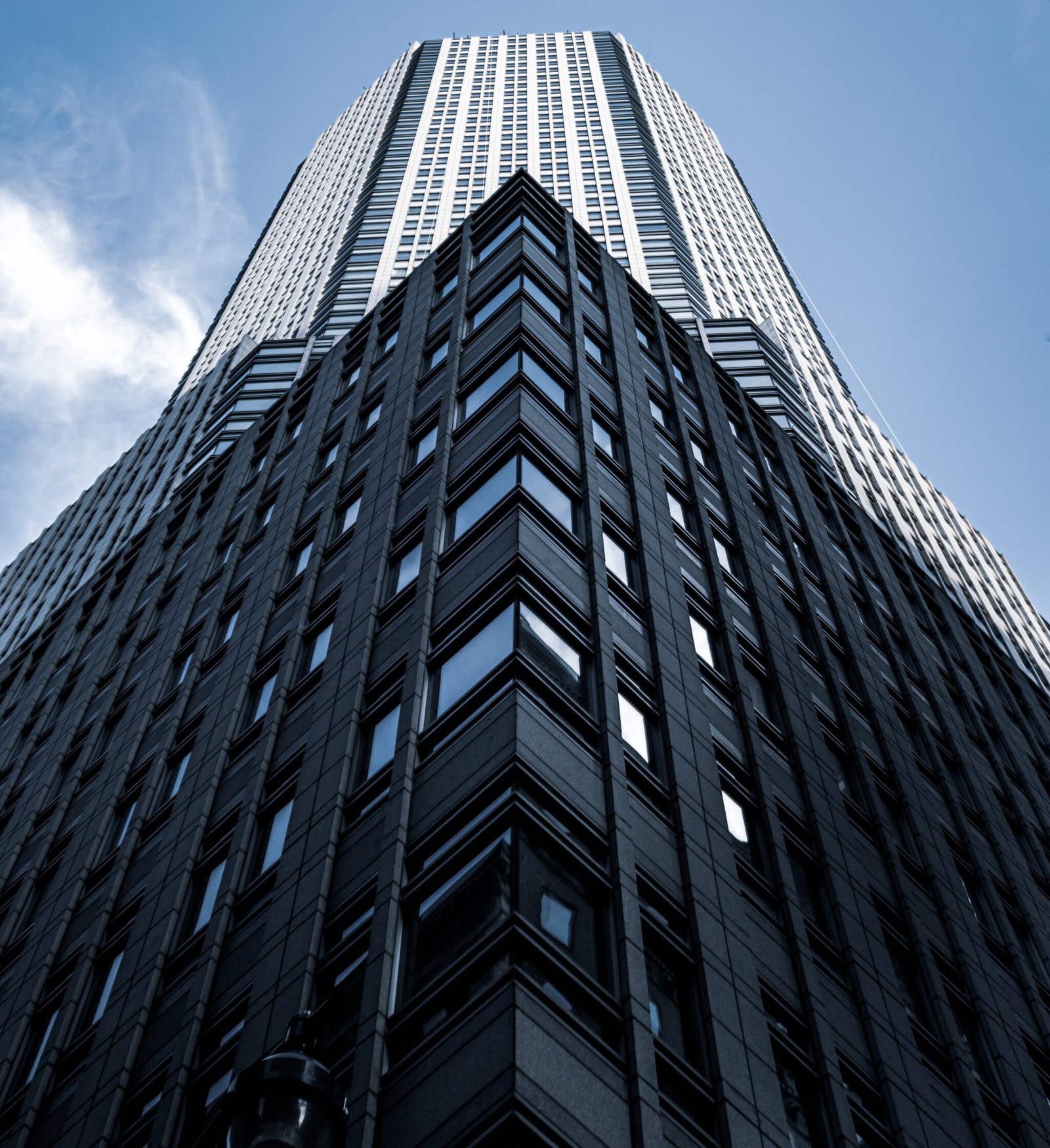 https://isellcommercialassets.com/wp-content/uploads/2025/12/low-angle-shot-tall-city-building-with-blue-sky-background-new-york-scaled-e1766776358161.jpg